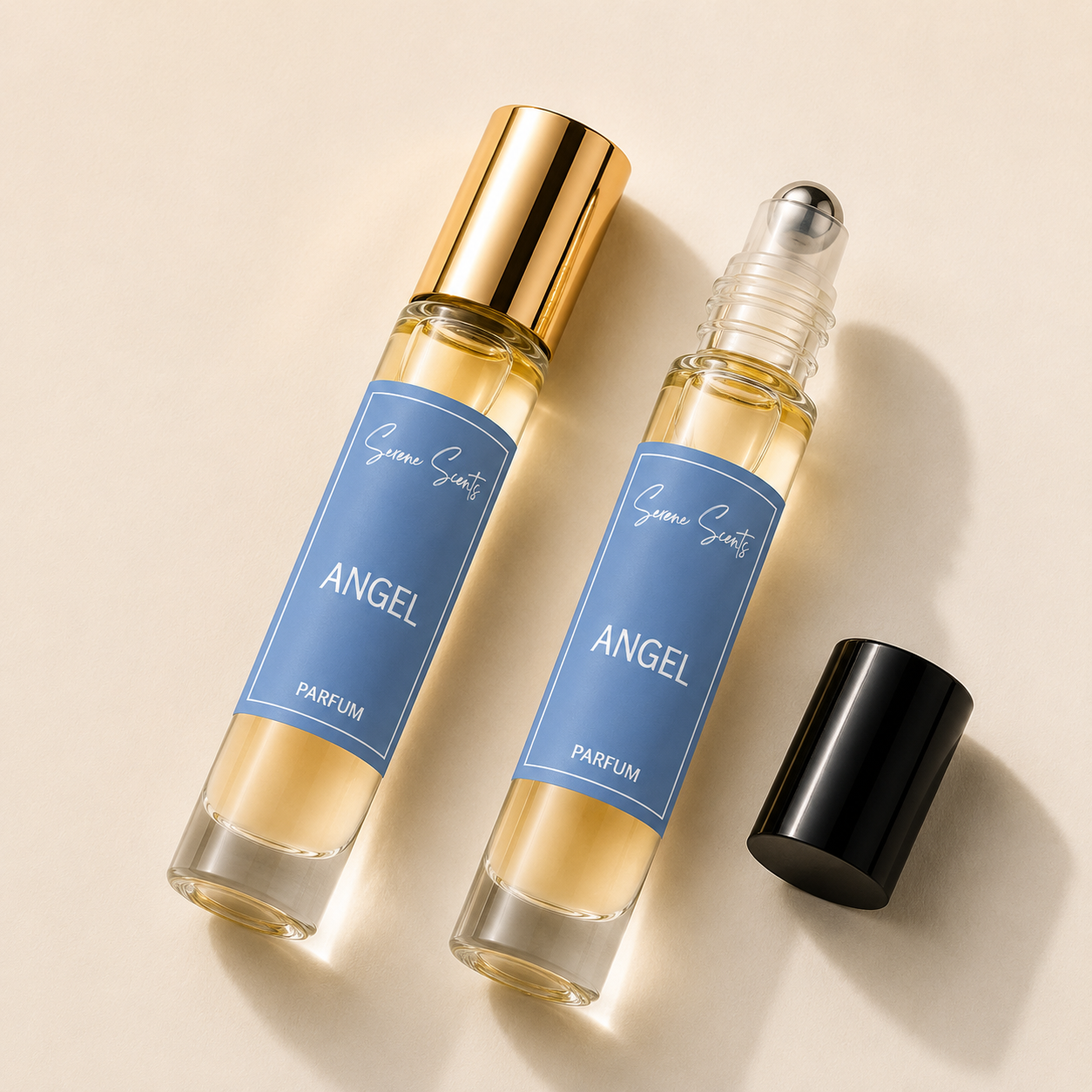 Two glass perfume rollerball bottles labeled 'Genevieve Sants ANGEL PARFUM' with blue labels, one with a gold cap and one with a black cap, arranged on a warm beige background.