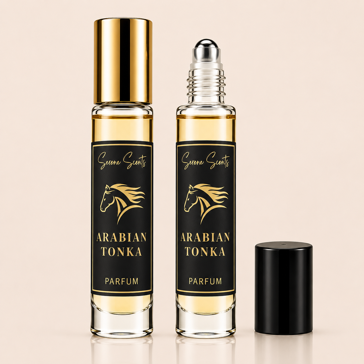 Two clear glass rollerball perfume bottles labeled 'Arabic Tonka' with black labels and gold lettering, one bottle with a gold cap and one with a silver rollerball and black cap, shown on a light beige background.