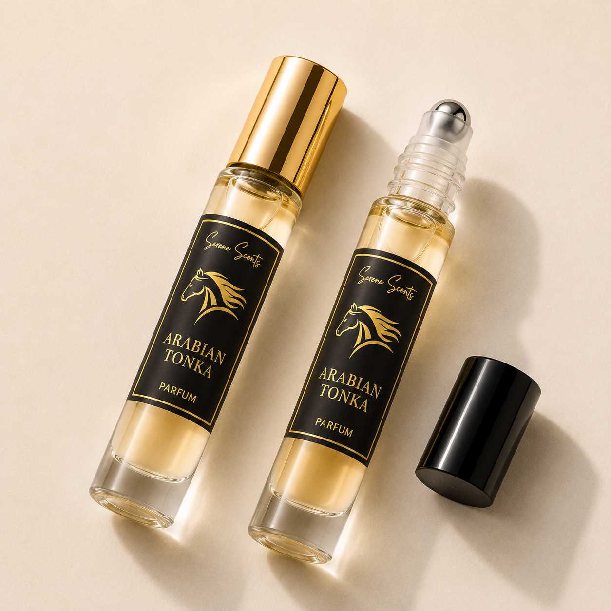 Two clear glass rollerball perfume bottles labeled 'Gene Sauty Arabian Tonka Parfum' with black labels and gold lettering, one bottle capped in gold and the other with its black cap removed, on a warm beige background.