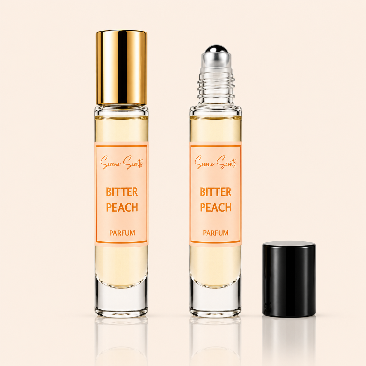 Two glass perfume roller bottles labeled 'Bitter Peach Parfum' by Scenic Scents, shown on a warm beige background. One bottle has a shiny gold cap and the other has a silver roller ball; a black cap sits beside them.