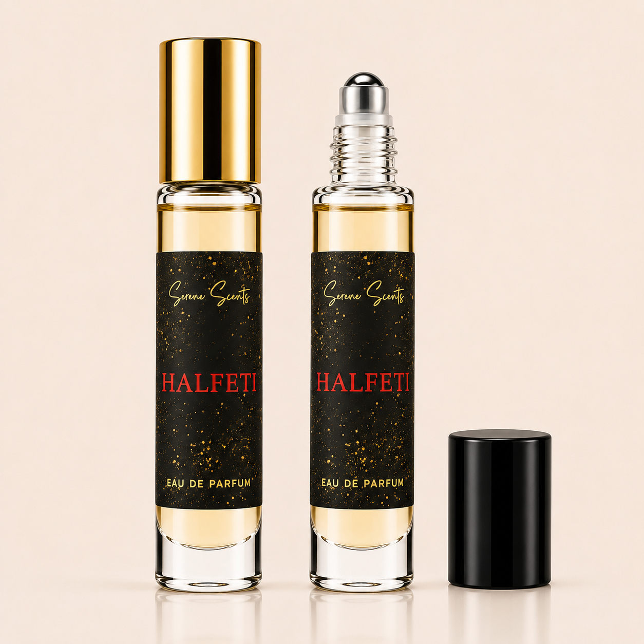 Two clear glass perfume roller bottles with black labels and gold lettering, one with a gold cap and one with a silver roller top, shown on a light beige background with a black cap placed beside them.