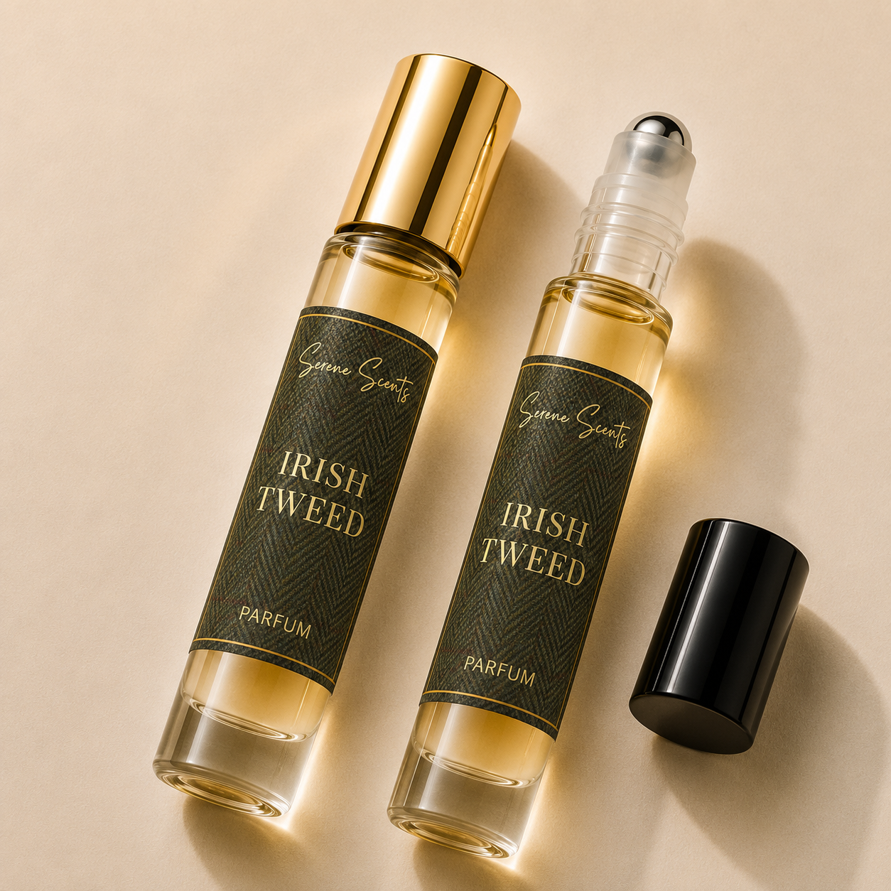 Two glass roll-on perfume bottles labeled 'Geneva Scentz Irish Tweed Parfum' with dark green labels and gold lettering, one bottle with a gold cap and one with a black cap, on a beige background.