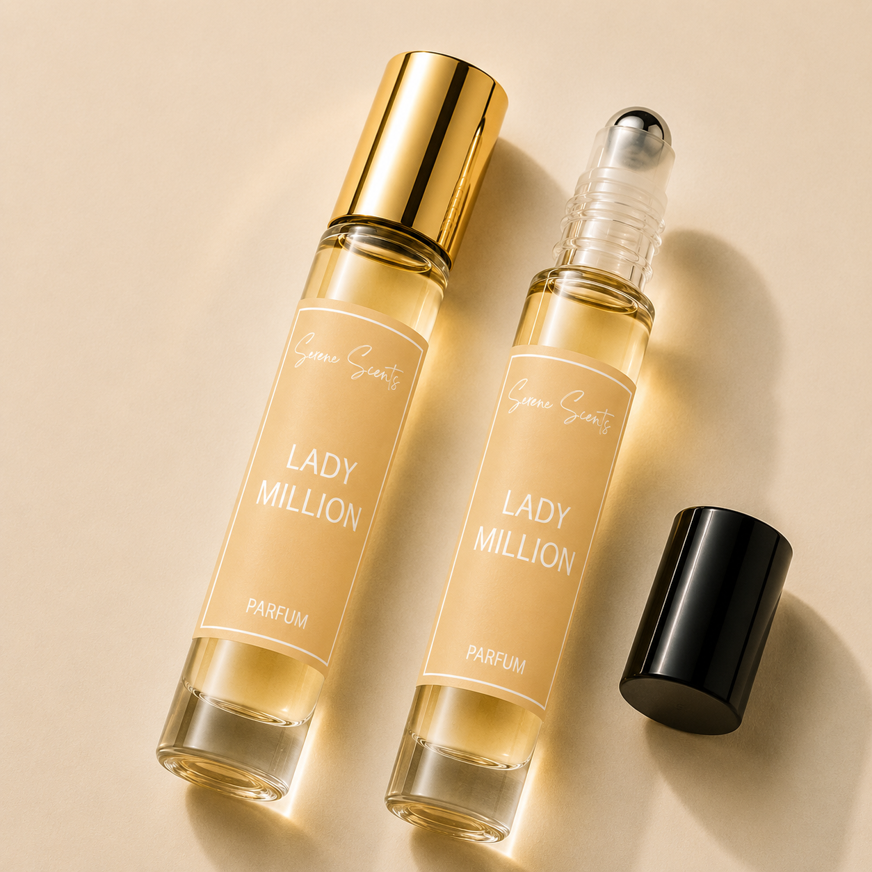 Two perfume roll-on bottles labeled 'Lady Million Parfum' by Grace Scents, one with a gold cap and one with a clear cap showing the rollerball, alongside a separate black cap, on a beige background.