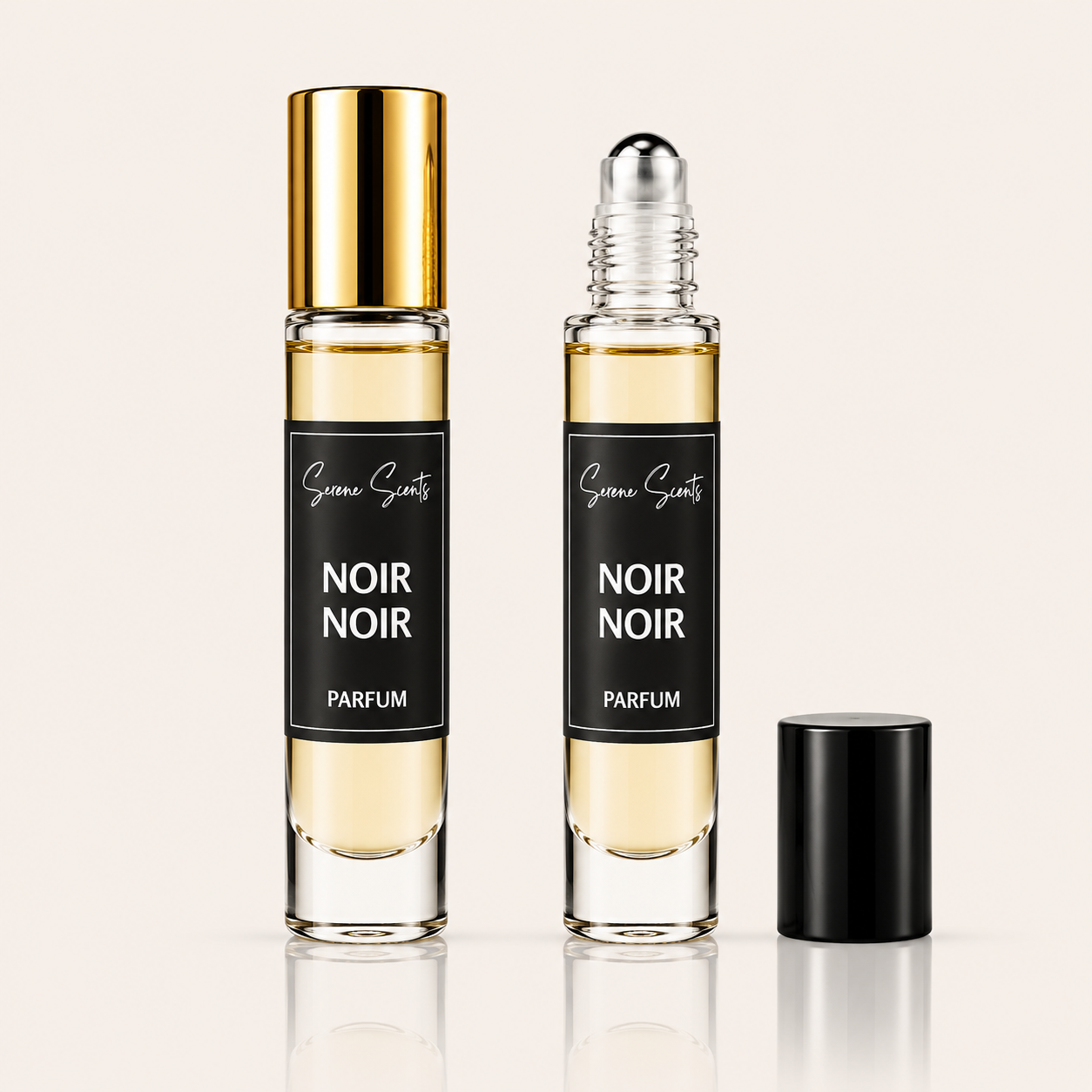Two glass perfume roller bottles labeled 'Scenic Scents Noir Noir Parfum' on a light beige background, with one bottle capped in gold and the other open with a separate black cap beside it.
