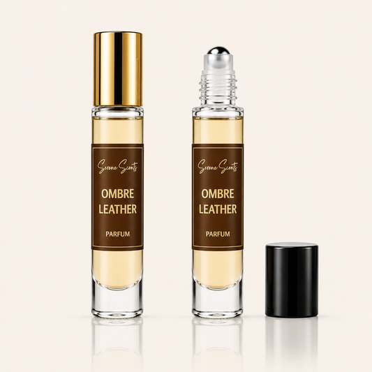 Two clear glass perfume roller bottles labeled 'Green Scents Ombre Leather Parfum' on a light beige background, with one bottle capped in gold and the other open with a black cap beside it.