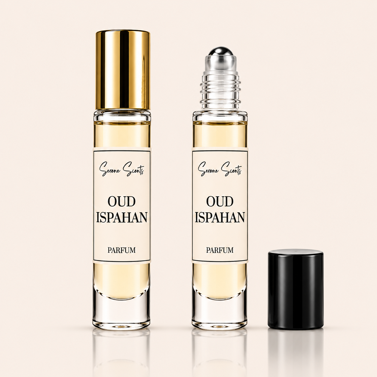 Two clear perfume roller bottles labeled 'Sanaa Scents Oud Ispahan Parfum' on a light beige background, with one bottle showing a gold cap and the other showing a silver roller ball, plus a separate black cap beside them.
