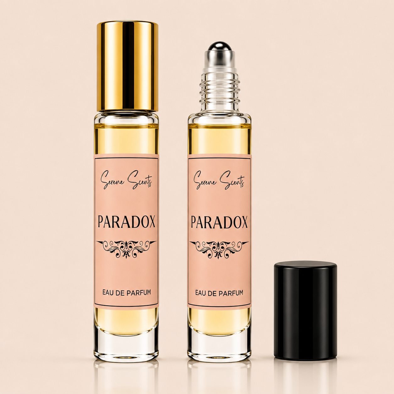Two clear glass rollerball perfume bottles with pale pink labels reading 'Geneva Gentry' and 'PARADOX EAU DE PARFUM' are shown on a warm beige background, one bottle with a shiny gold cap and the other with a clear cap and silver rollerball, plus a separate black cap standing beside them.