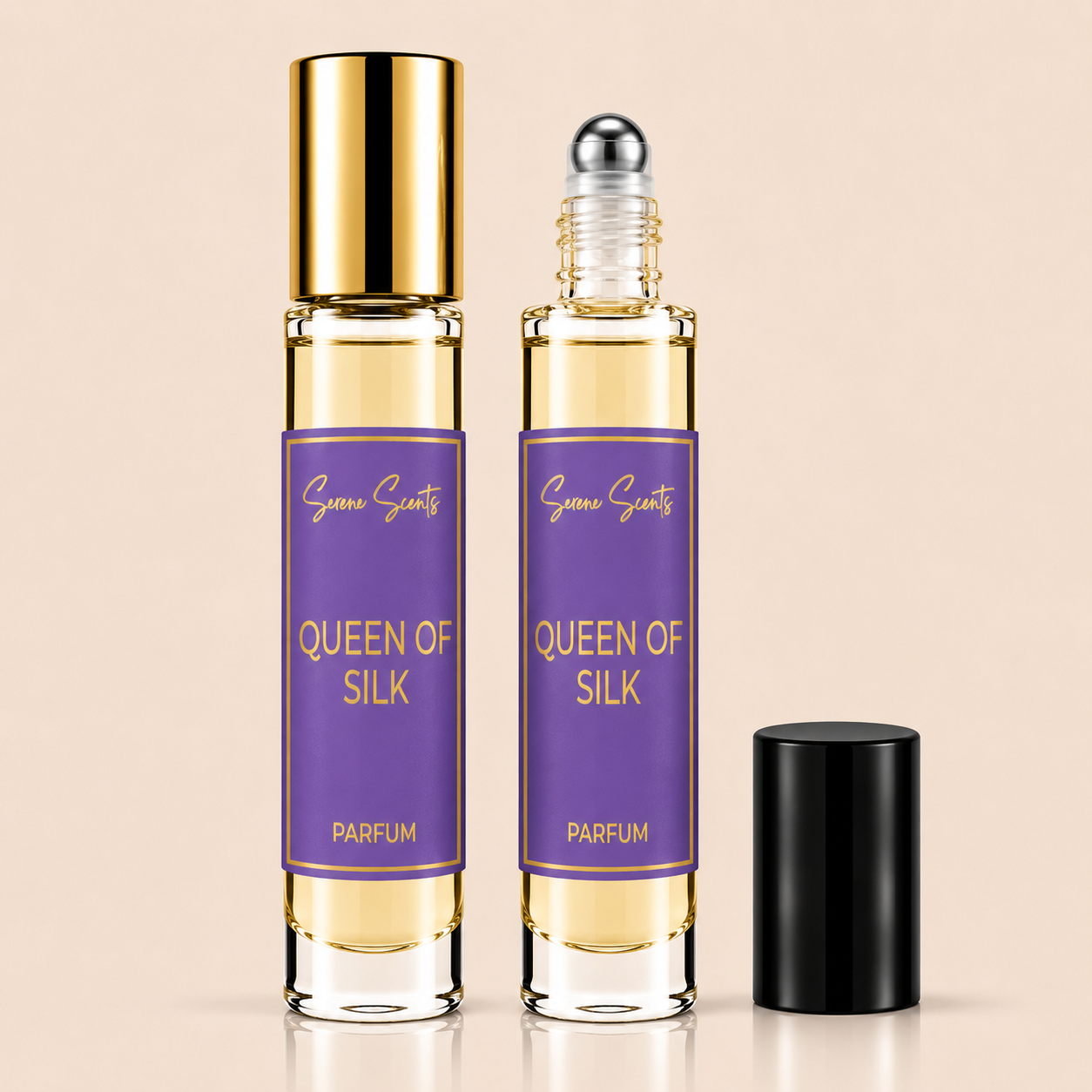 Two glass perfume roll-on bottles labeled 'Queen of Silk' by Scenic Scents, shown on a warm beige background. One bottle has a gold cap and the other has a black cap removed from it, with the clear glass revealing a pale yellow liquid inside.