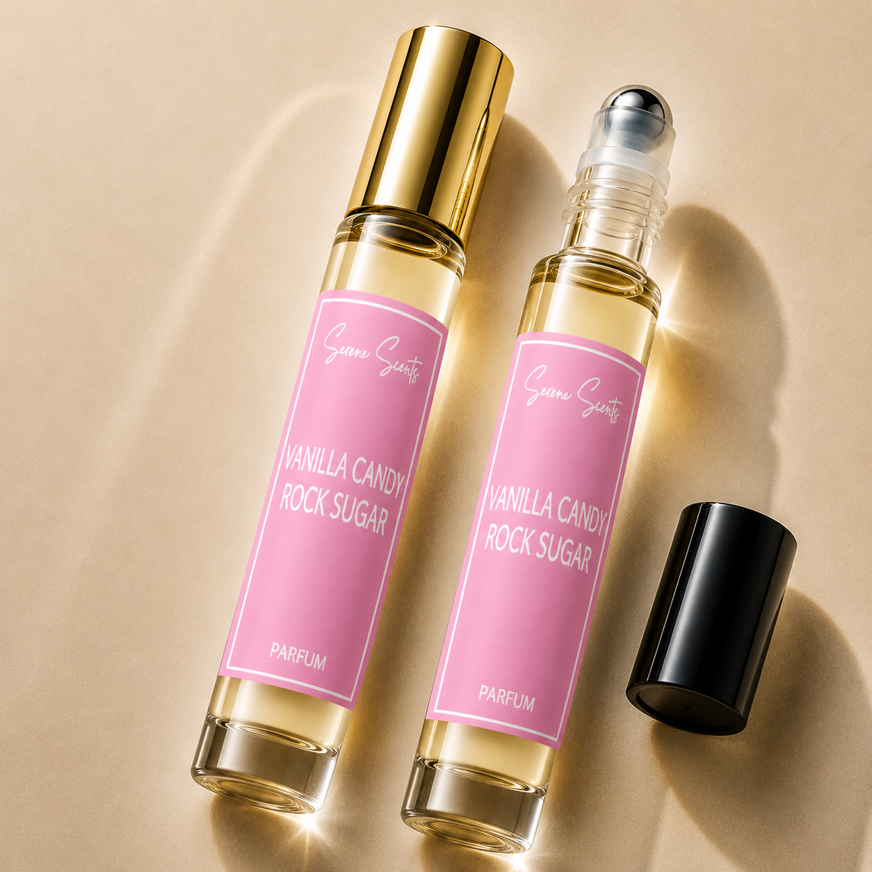 Two glass perfume roller bottles labeled 'Vanilla Candy Rock Sugar' by Scenic Scents, with one bottle showing a gold cap and the other showing a black cap, set on a beige background with soft shadows.